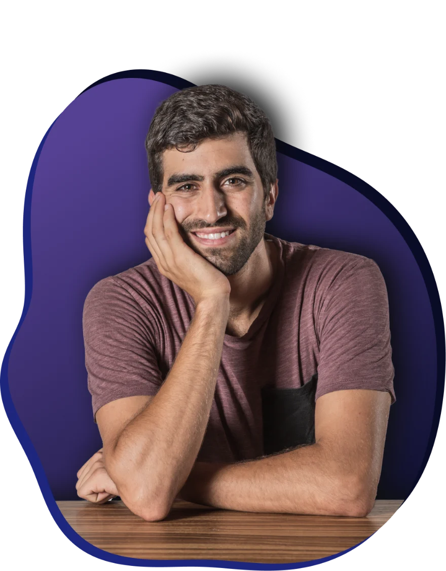 Rotem Avny, smiling, his hand resting on his cheek.
